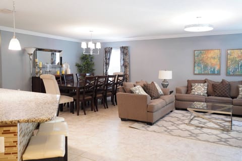 An inviting living and dining area, perfect for socializing, relaxing, or enjoying a family meal.