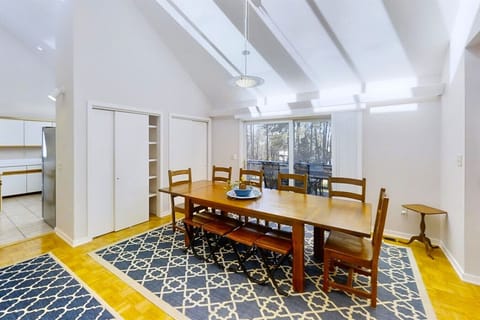 Gather around a spacious table that seats 10, with the lake as your backdrop.