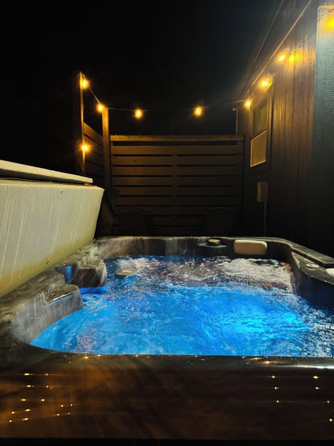 Soak in your private hot tub under the stars • Couples retreat