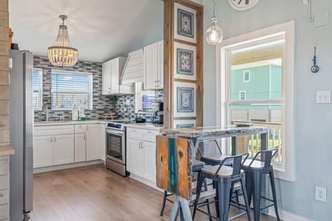 Another view of the dining space and the kitchen