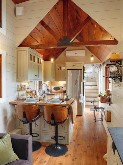 Bright, airy living space with mountain, pastoral field & peek a boo lake views