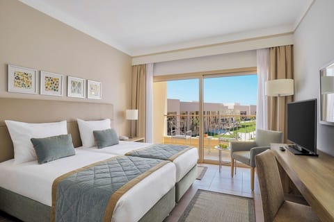 Relax by the window as resort gardens stretch beyond.