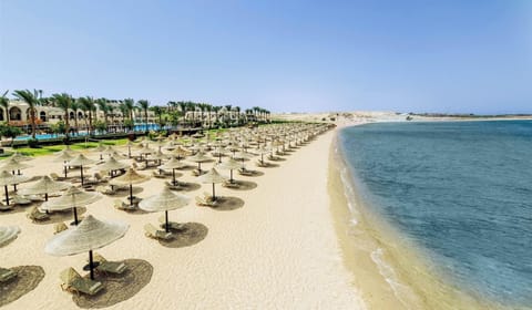 Soak up endless beachfront bliss with loungers and calm waters.