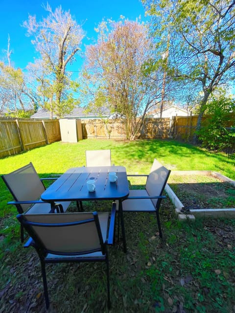 Relax and enjoy your morning coffee in the private backyard. 