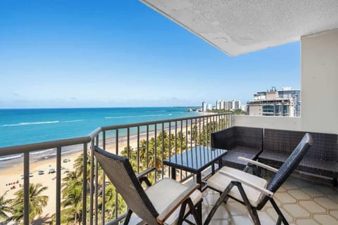 Wake up to paradise! Your private balcony offers breathtaking panoramic views of the sparkling turquoise ocean and golden sands, perfect for your morning coffee or evening cocktails.