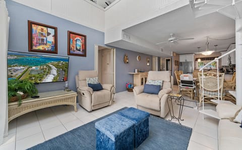 Comfortable living room with a spiral staircase leading up to the family loft space