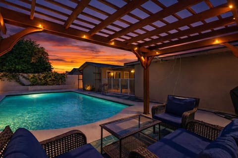 Outdoor Pool Area. Some exterior lighting shown in this image may not be present or turned on during your stay. 