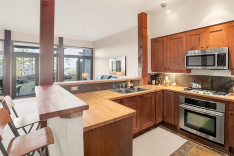 View from kitchen, bar seating