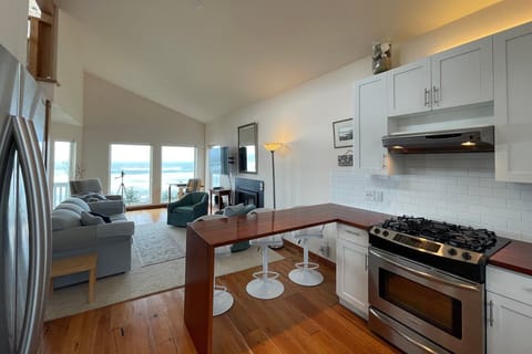 The kitchen has a peninsula bar to keep the cook company.