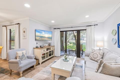 Large sliding glass doors opening to a private balcony view.