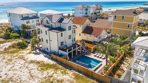 Elegant coastal exterior of Liquid Assets just steps from the beach