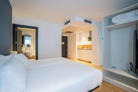 Settle in with a comfy bed and handy kitchenette nearby.