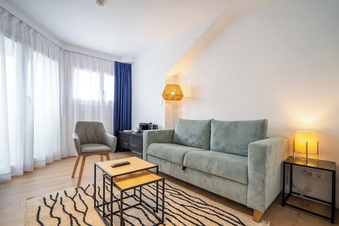 Stretch out on the sofa and enjoy sunlit relaxation.