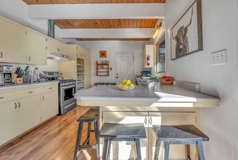 Kitchen: Smaller in size yet fully equip to cook a family meal. Authentic wood-beamed ceilings and vintage cabinetry equipped with a drip coffee maker, toaster, blender, and essential cooking utensils.
