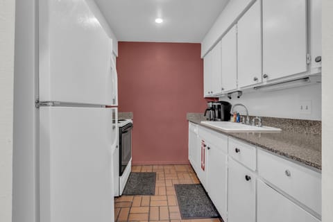 Kitchen: Main floor, drip coffee maker, Keurig, toaster, waffle maker, cooking utensils, tableware