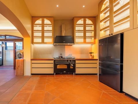 This high end chef's kitchen features a 7 plate Lofra stove