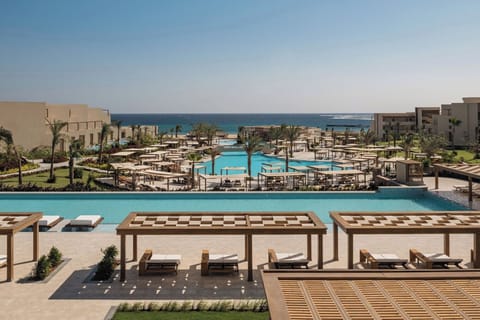 Explore the expansive resort pools framed by ocean horizons.