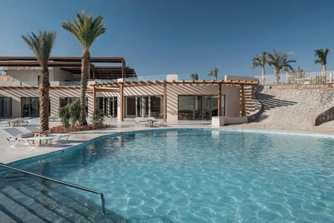 Cool off in a quieter pool with sunlit, breezy decks.