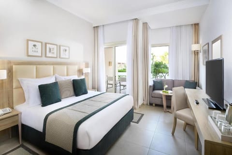 Sink into a spacious king bed in airy, sunlit comfort.