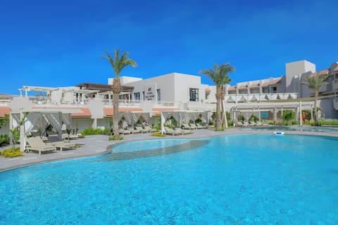 Lounge in private cabanas beside sparkling water all afternoon.