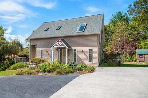 Charming front exterior with covered porch