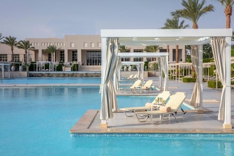Lounge in your shaded cabana with cocktails within reach.