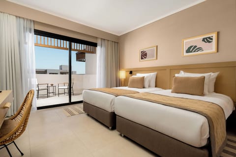 Wake refreshed in twin beds with morning light streaming in.