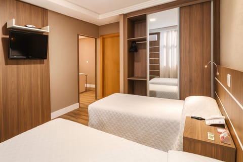 Settle in with ample wardrobe storage and wall-mounted TV.