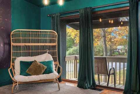 Peaceful porch nook w/ hanging chair swing, the perfect spot to relax and unwind.