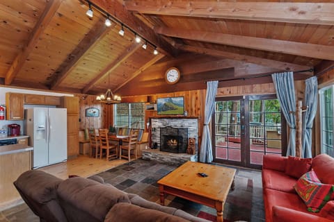 Open-concept living with cathedral ceiling.