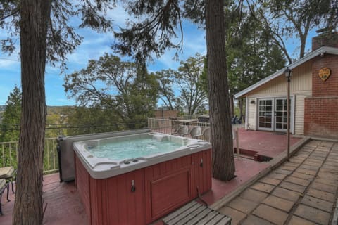 Private hot tub beneath the pines with stunning mountain views