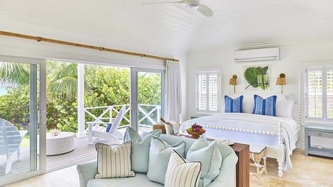 Lounge lazily in bed with plush pillows and garden light.