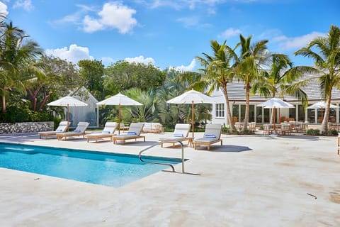 Lounge poolside in the sun, steps from open-air dining.
