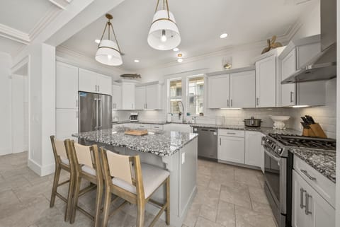 Large kitchen island includes seating for 3.