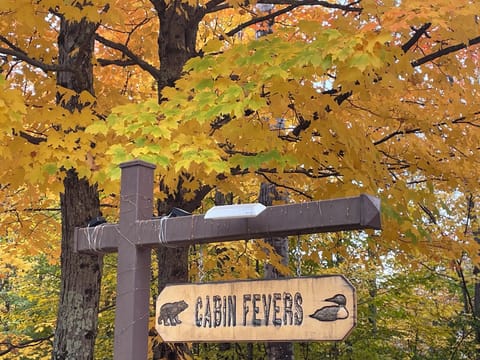 Cabin Fevers sign along the road - Your cozy Up North Cabin Rental at Powderhorn
