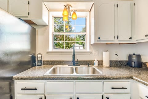 Kitchen Sink | Double Basin with Modern Faucet and Window Overlooking Backyard