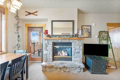 Gather around the fireplace after a day of exploring. | Main Level
