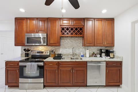 Open, bright, and ready to serve—our kitchen is basically an invitation to gather, laugh, and eat your way through vacation.