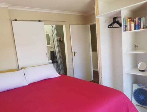 Main bedroom with King XL bed, soft linens and blackout curtains