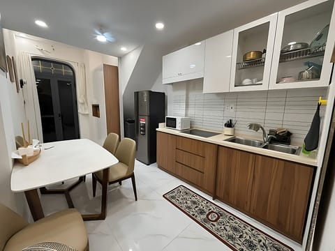 Main area of the apt, bedroom and bathroom are at the back of the camera