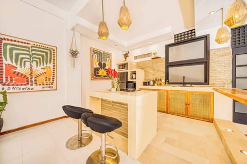 Inviting kitchen with warm accents and a cozy gathering spot