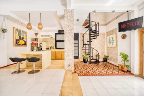 Stylish open-plan kitchen and lounge with warm lighting and modern accents