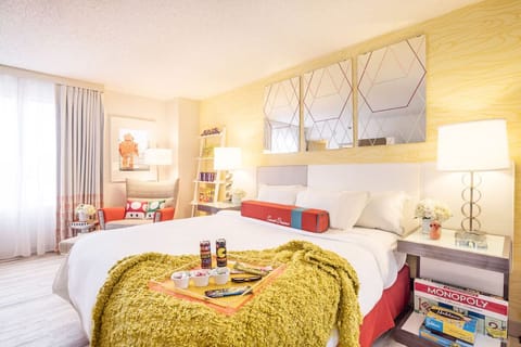 Stretch out on a cloud-soft bed beside cheerful retro accents.