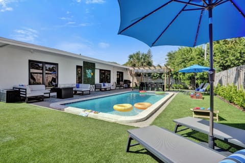 Beautiful pool area with turf lawn. The perfect setting to enjoy the day.