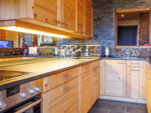 Kitchen, Countertop, Wood, Flooring, Cabinetry, Kitchen Appliance, Interior Design, Sink, Floor, Major Appliance