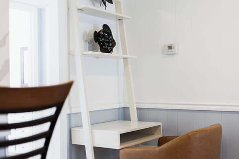 Reading Nook: Stylish workspace with modern décor, ideal for coffee breaks or catching up on charting in this insurance relocation housing in Temple TX.