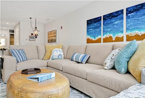 Great room with space for the entire fam. Enjoy 70:" TV, shuffleboard, and more.