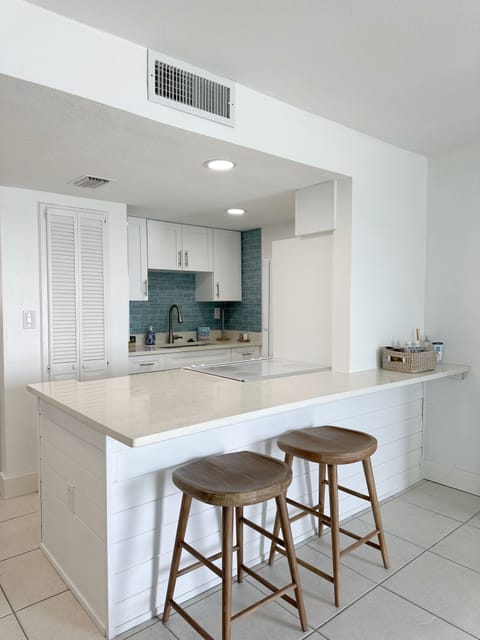Kitchen counter seating with view of kitchen 