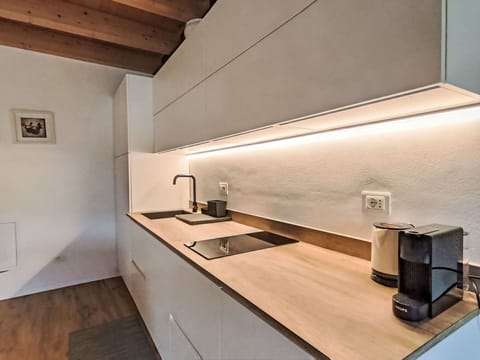 Kitchen, Interior Design, Wood, Flooring, Countertop, Ceiling, Floor, Kitchen Appliance, Lighting, Home Appliance