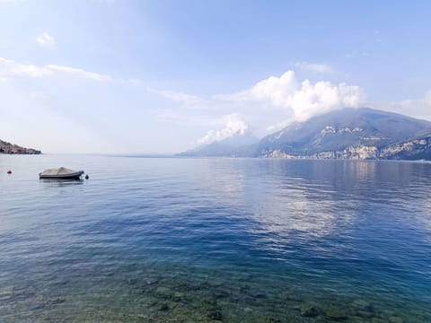 Sky, Blue, Water, Mountainous Landforms, Body Of Water, Water Resources, Mountain, Horizon, Cloud, Coastal And Oceanic Landforms